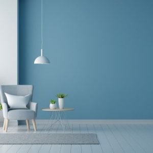 Premium Photo _ Gray armchair in blue living room with copy space